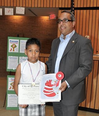 Second place poster contest winner poses with the Mayor of Passaic